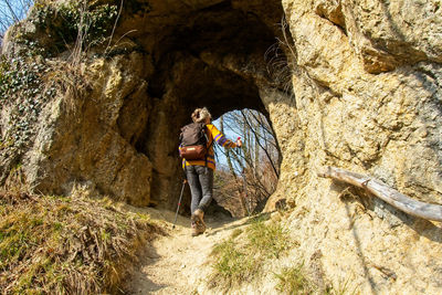 People walking on rock formation