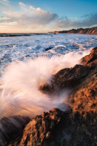Scenic view of sea against sky during sunset