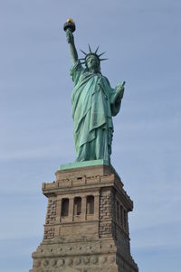Low angle view of statue against sky
