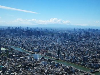 High angle view of city buildings against sky