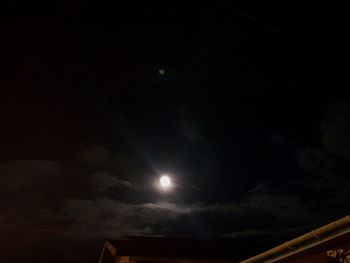 Low angle view of moon in sky at night