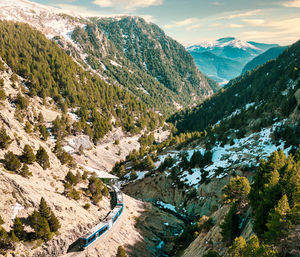 High angle view of snowcapped mountains against sky