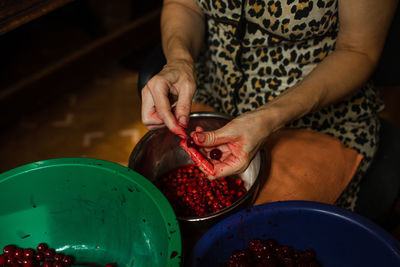 Midsection of man preparing food