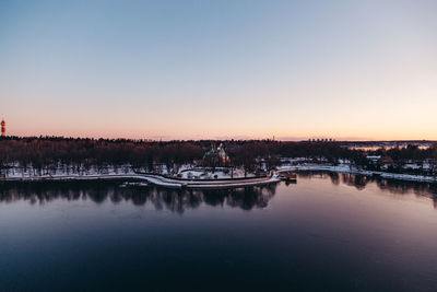 Panoramic view of lake against clear sky during sunset