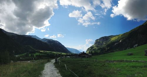 Panoramic view of road amidst mountains against sky