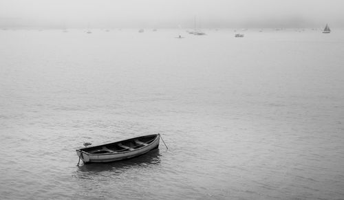 Rowboat on the sea on a foggy morning 