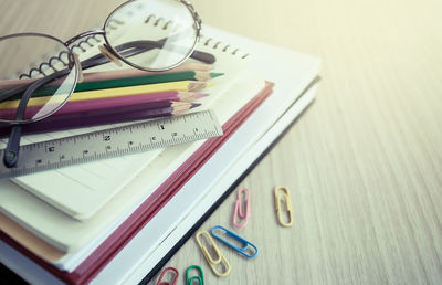 Close-up of school supplies on table