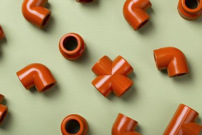 High angle view of toy blocks on yellow background