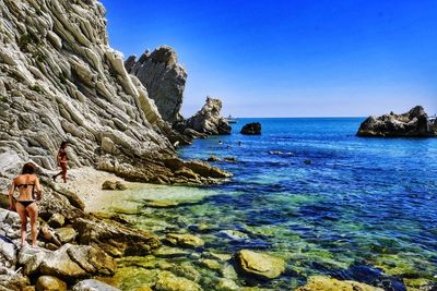 Scenic view of sea against clear blue sky