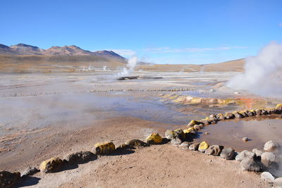 Scenic view of hot springs against sky