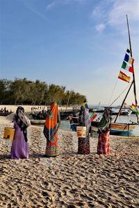 Rear view of people on beach