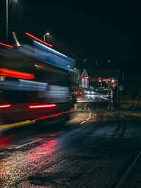 Blurred motion of vehicles on road at night