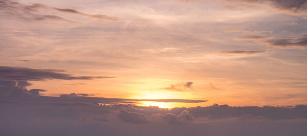 Low angle view of dramatic sky during sunset