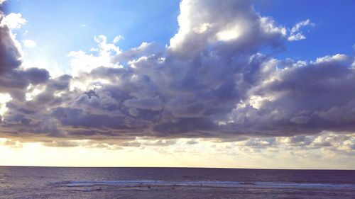 Scenic view of sea against dramatic sky