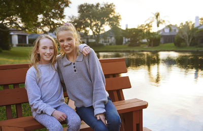 Portrait of a smiling young woman sitting outdoors