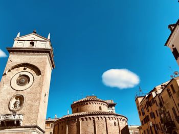 Low angle view of buildings against blue sky