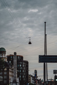 Low angle view of buildings against sky at dusk