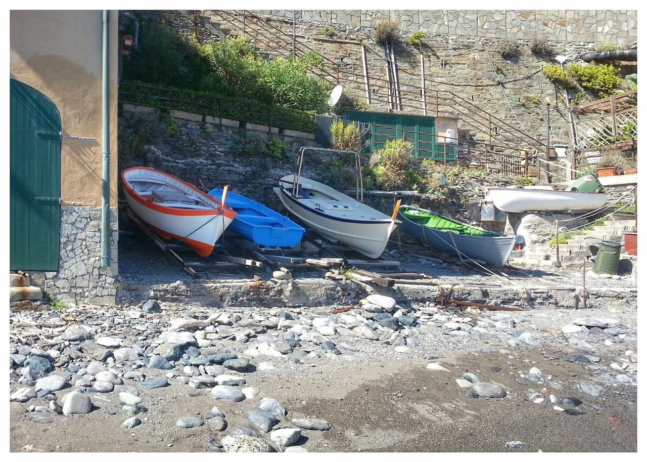 BOATS MOORED ON RIVERBANK