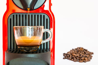 Close-up of coffee cup against white background