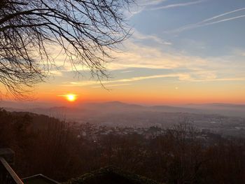 Scenic view of landscape against romantic sky at sunset