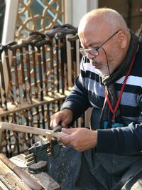Man working on wood