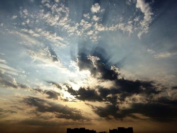 Low angle view of cloudy sky at sunset