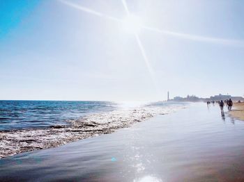 Scenic view of sea against sky on sunny day