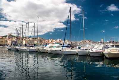 Boats moored at harbor