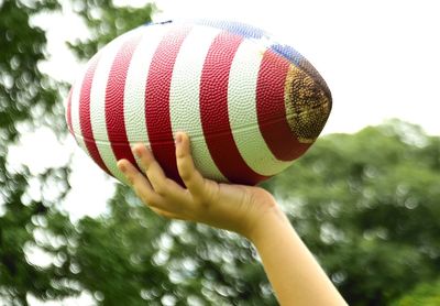 Close-up of hand holding ball