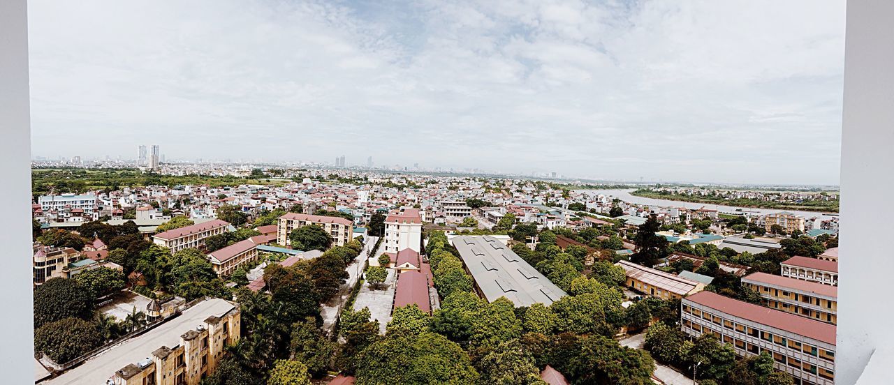 architecture, city, built structure, cityscape, building exterior, high angle view, sky, tree, crowded, day, cloud, outdoors, cloud - sky, residential district, aerial view, no people, canal, city life, office building, horizon over land