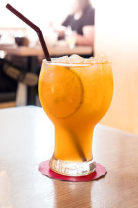 Close-up of orange juice on table