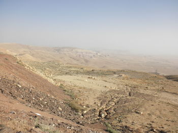 Scenic view of desert against clear sky