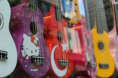 Close-up of guitar on display at store