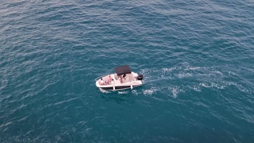 High angle view of man on boat in sea