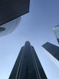 Low angle view of modern buildings against sky