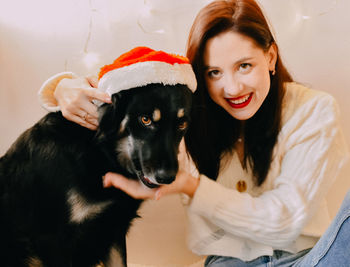 Portrait of young woman with dog