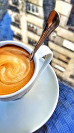 Close-up of coffee cup on table