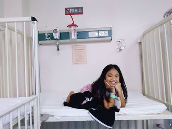 Portrait of girl on bed in hospital