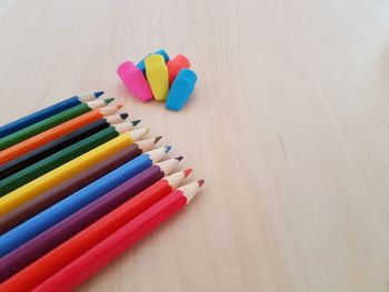 High angle view of multi colored pencils on table