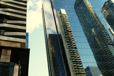 Low angle view of skyscrapers against sky