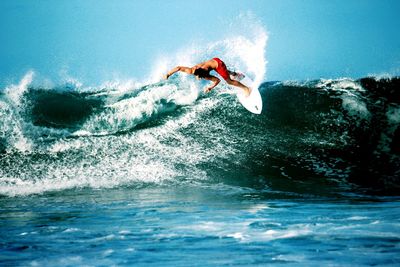 People surfing in sea