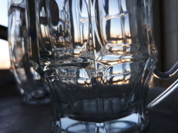 Close-up of wine glasses on table