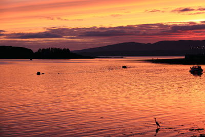 Scenic view of sea at sunset