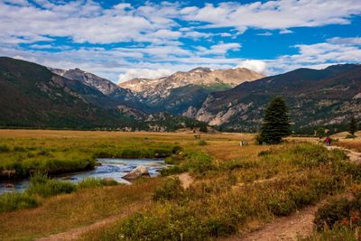 Scenic view of landscape and mountains against sky