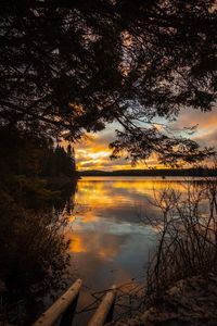 Scenic view of lake against sky during sunset