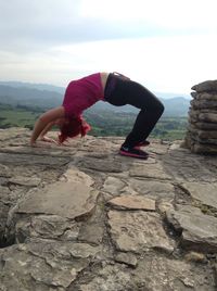 Woman standing on rock