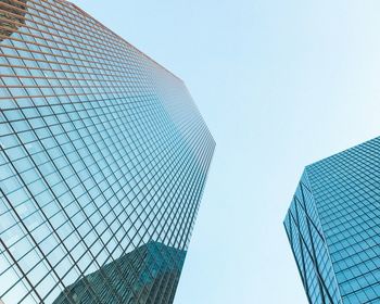 Low angle view of modern buildings against clear sky