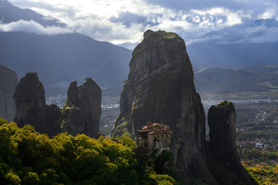 Scenic view of mountain against cloudy sky