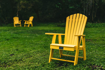 Empty chairs on field