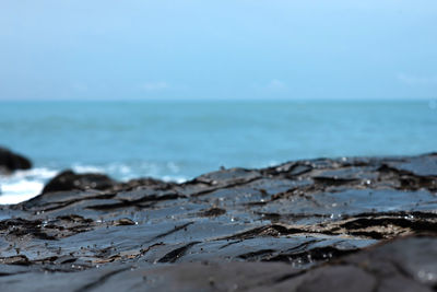 Surface level of beach against sky